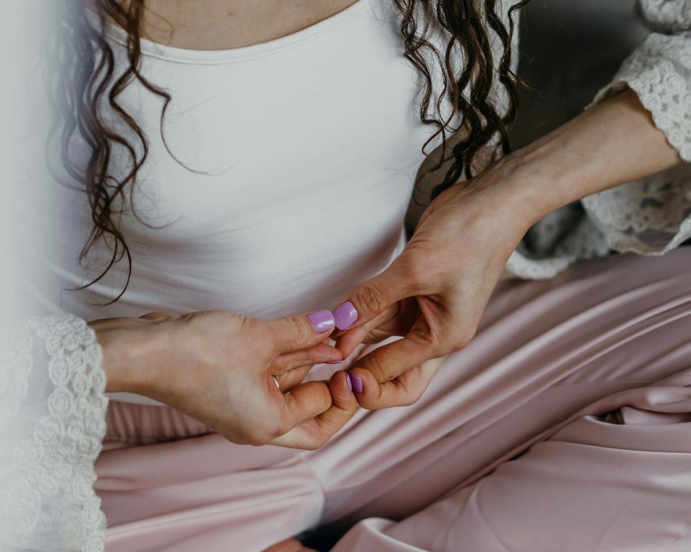Close up of yoga practitioner hands during a flow.