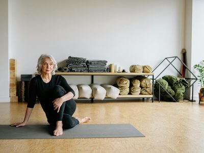 Yoga block on a dark wooden floor.